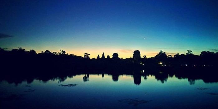 Angkor Wat outline during Sunrise.